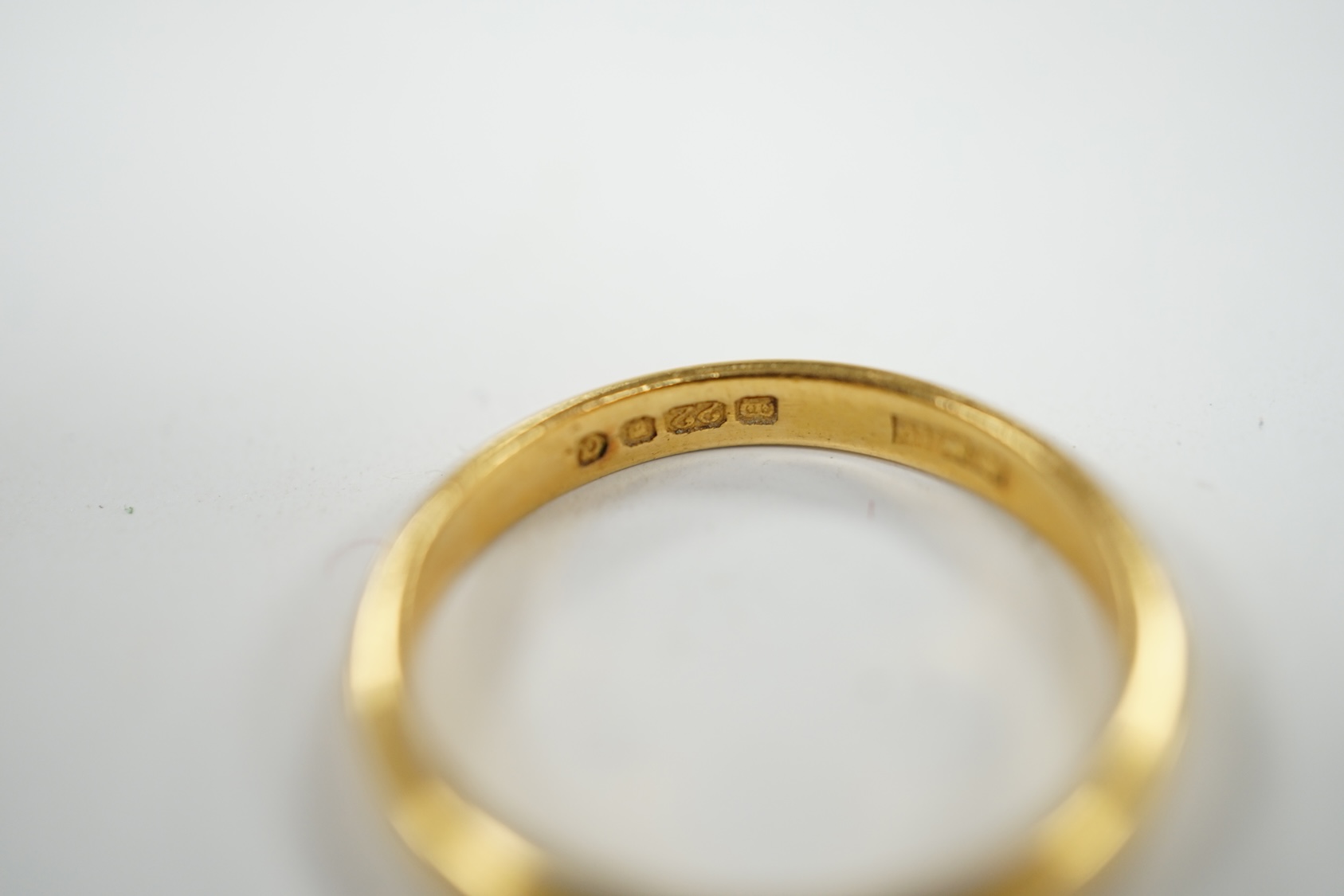 A 22ct gold wedding band, size N, 3.3 grams. Condition - fair to good